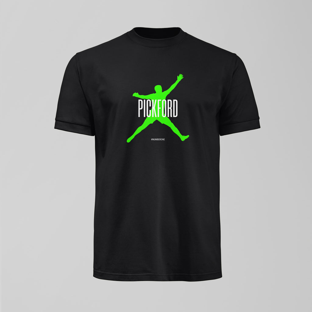 Black t-shirt with green and white graphic design on a gray background